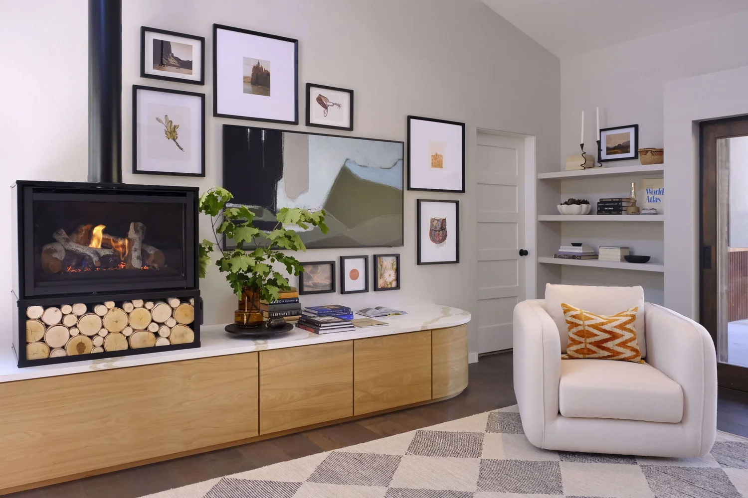 Curved wood fireplace surround and media built-ins